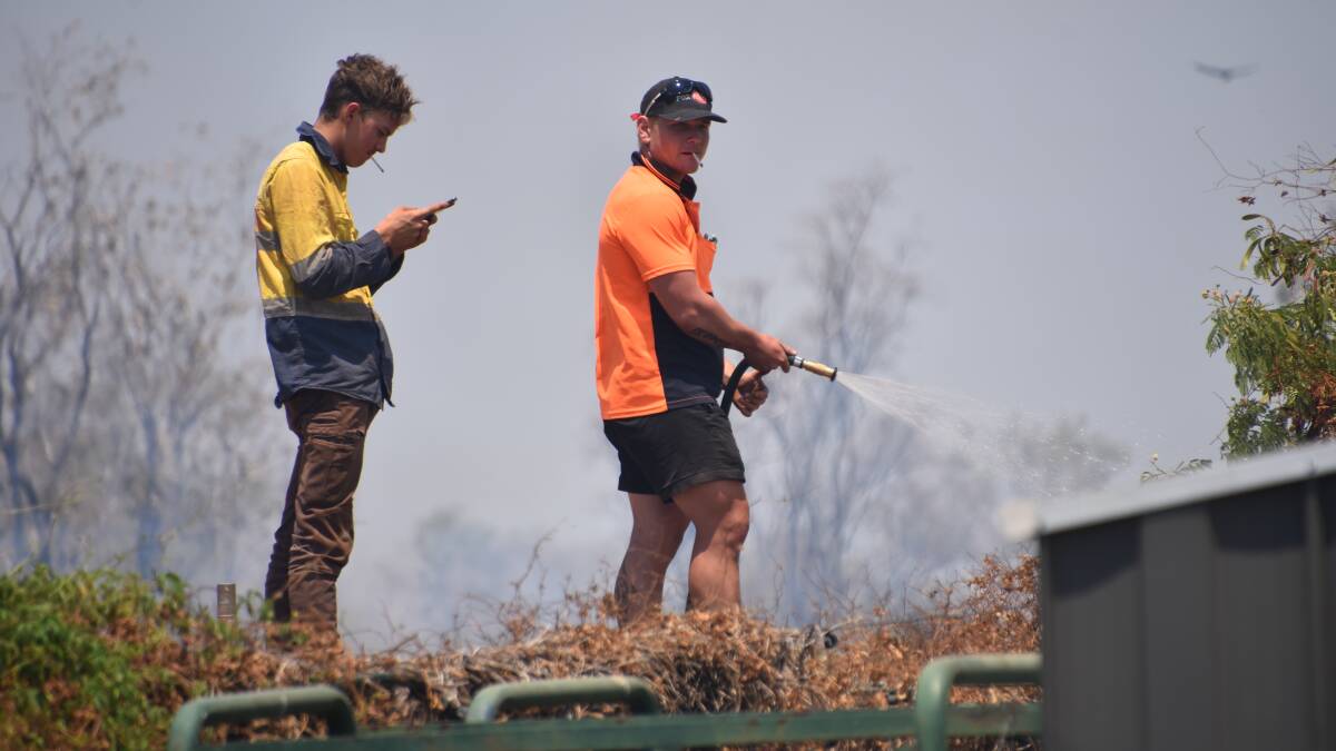 All hands on deck as flames threaten the Katherine Golf Club grounds