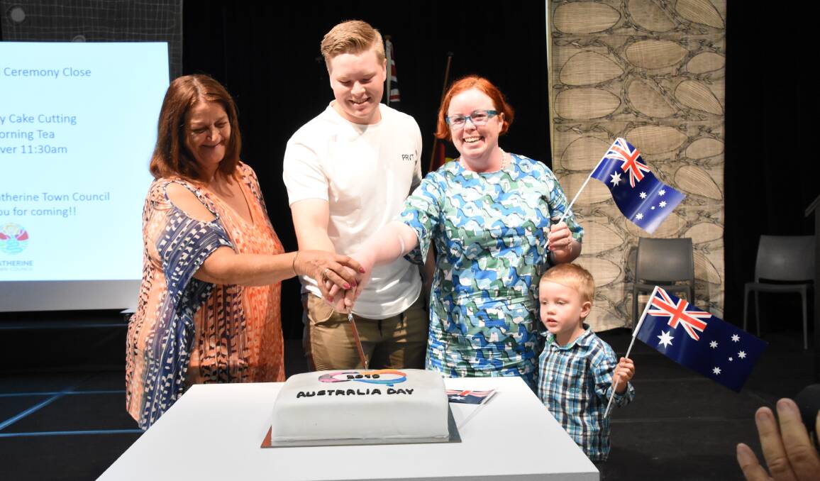 Australia Day award ceremony winners, Sue Pszkit, Mitchell Ford and Mandy Tootell cut the celebratory cake.
