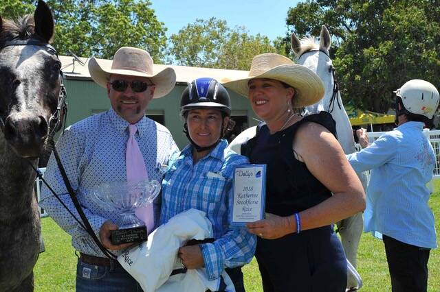 RACING ROYALTY: The Stock Horse Race was run to honour Dolly's Dream. Tick and Kate Everett, Dolly's parents stand with the winner of the Stock Horse Race, Vero Jaccard. Photo: Max Rawlings. 