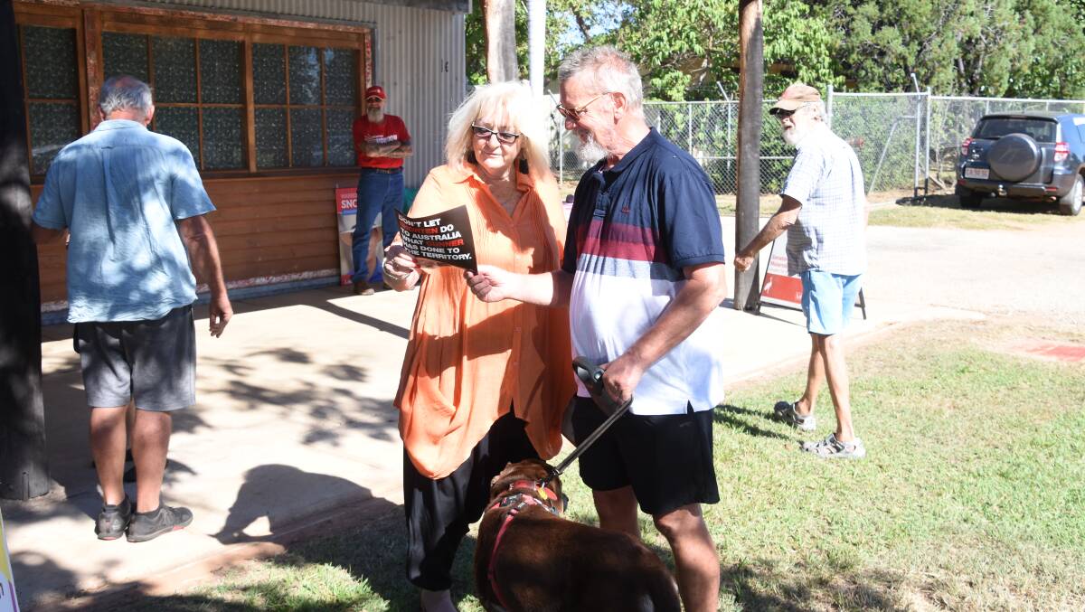 Peter Young and his dog Bear from the Gold Coast have opted to vote early in Katherine as they will be on the road on election day. 