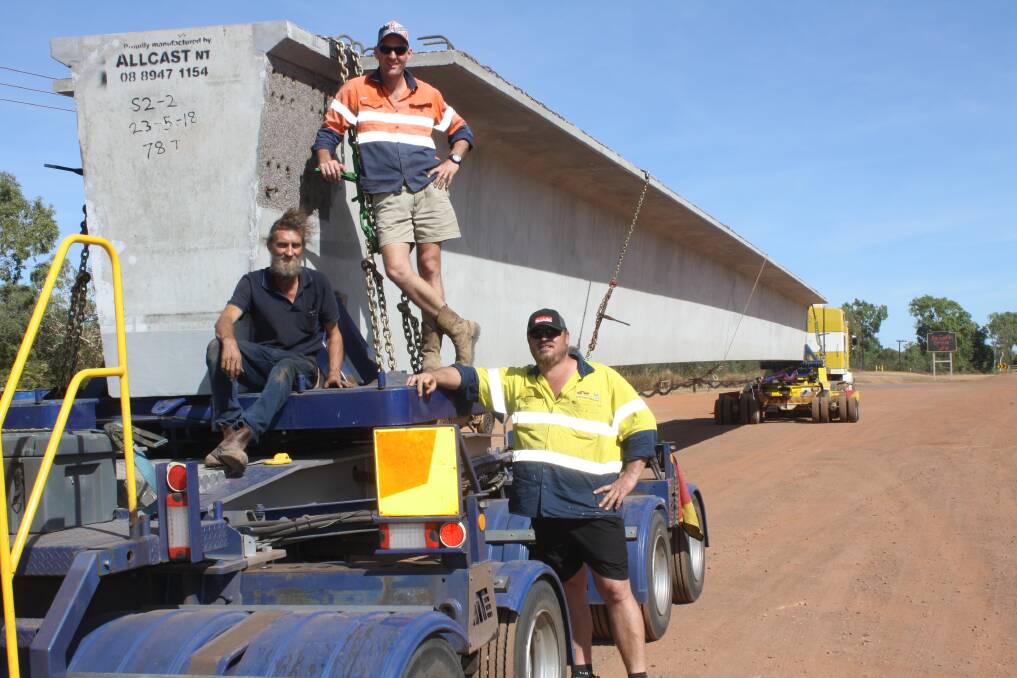BEAMING: Just some of the team behind getting 24 of these beams to WA. Drivers Neil "Scruffy" Gallagher and Dru Normot with operations manager of Slingshot Haulage Chad Dehne. 