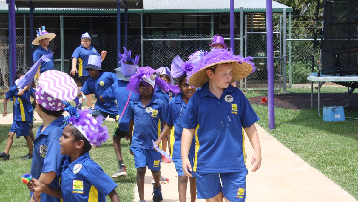 The kids showed off their hats on a walk around the new path built by the RAAF. 