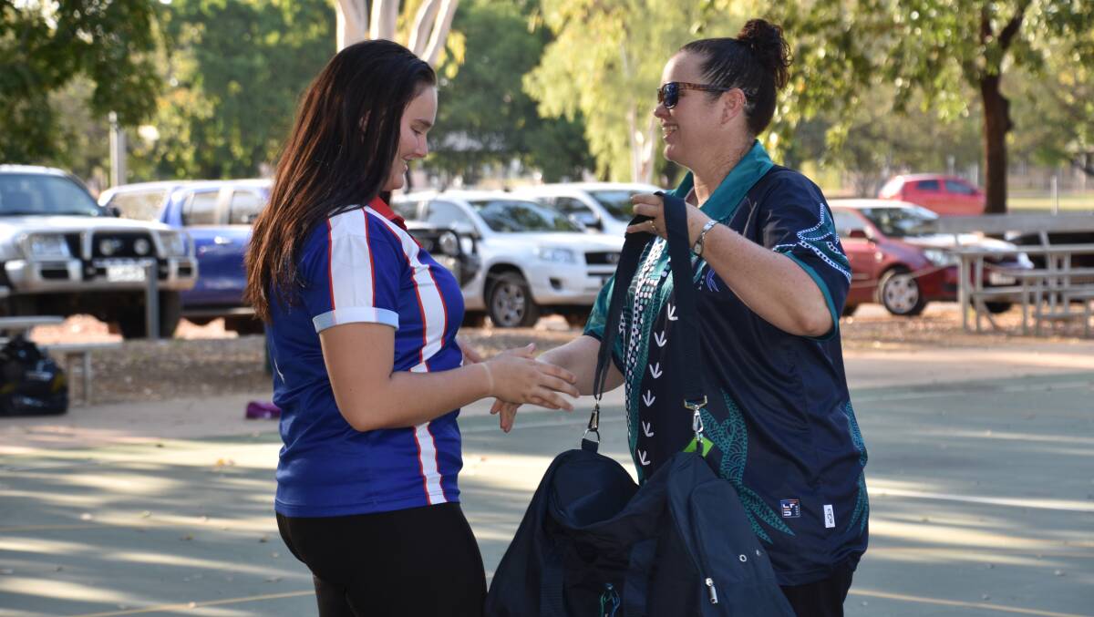 Katherine Netball Association coordinator and coach for the U15 team Donna Bryant handed out bags and new uniforms to the players.