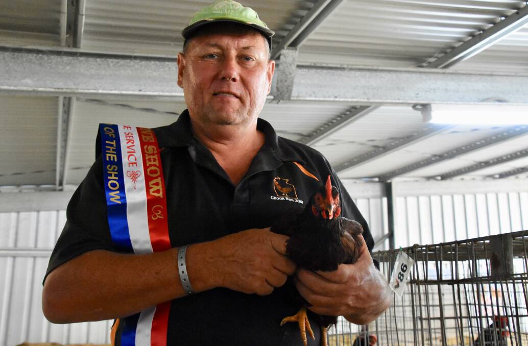 Ian Young with his champion Rhode Island Red Bantam. 