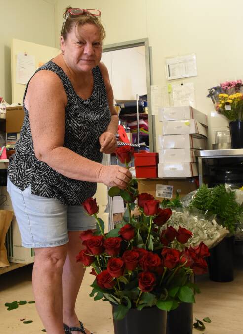 Robyn O'Brien is expecting to be working late tonight to make sure all of the roses are ready for Valentine's Day. 