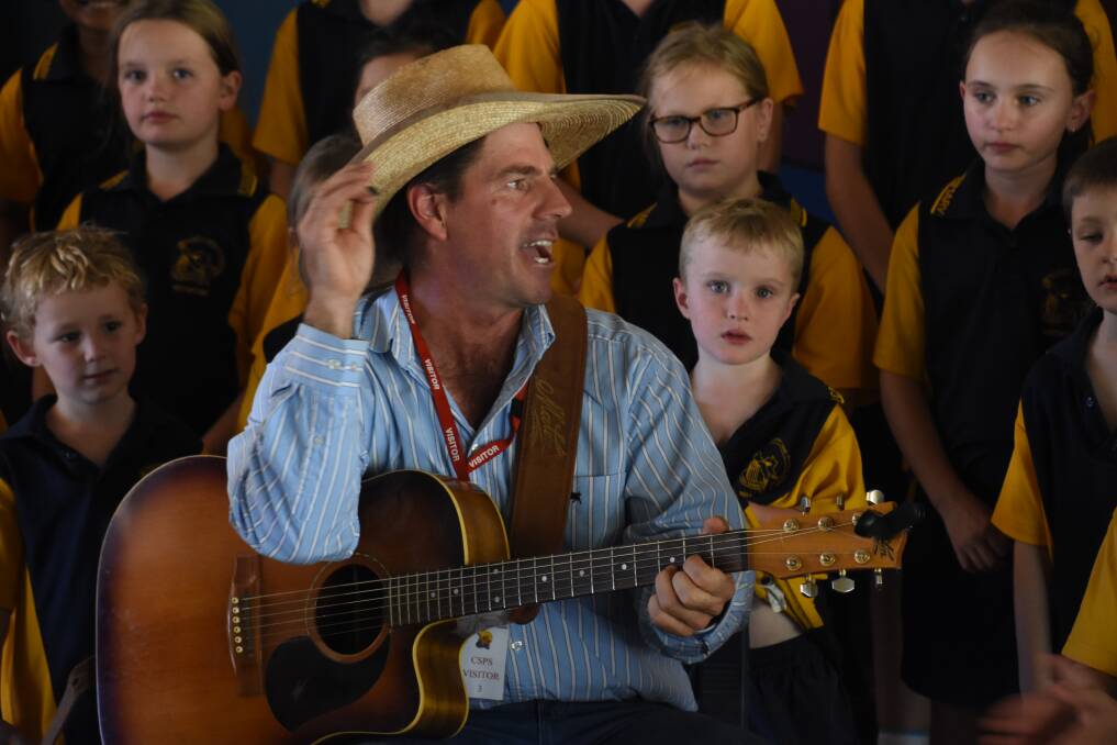 IDOL: Tom Curtain was at Casuarina Street Primary School today to spread the anti-bullying message. Students also got the chance to talk to their idol about why he wrote the song. 