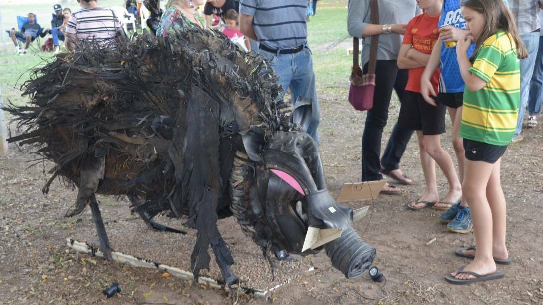 HIGHWAY CREATION: Ben Lewis created this winning boar out of tire blowouts, WW2 tar left near the Stuart Highway, star pickets and broken road side reflectors for the 2018 Junk Festival. Photo: Penny Walkner.