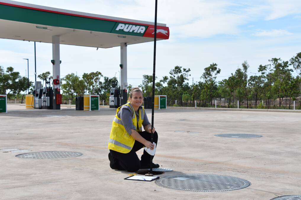 Manager of the new Puma Energy service station Shelley Troy tests the petrol levels. 