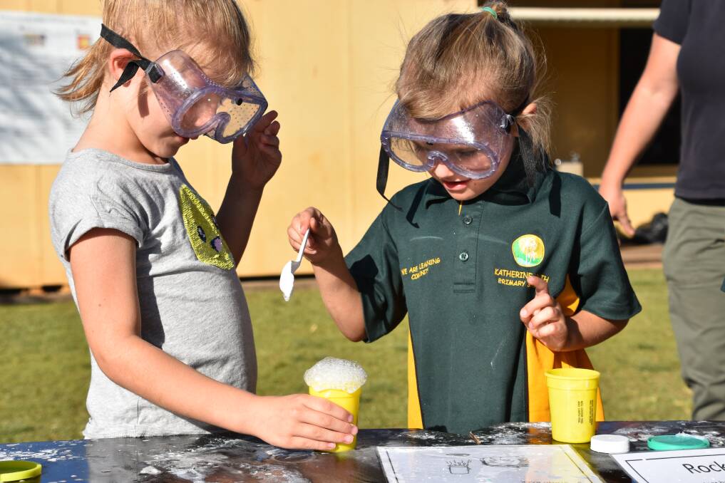 Rachel Drury and Lily Wright creating explosions at Katherine South Primary School's Science Week 2018. 