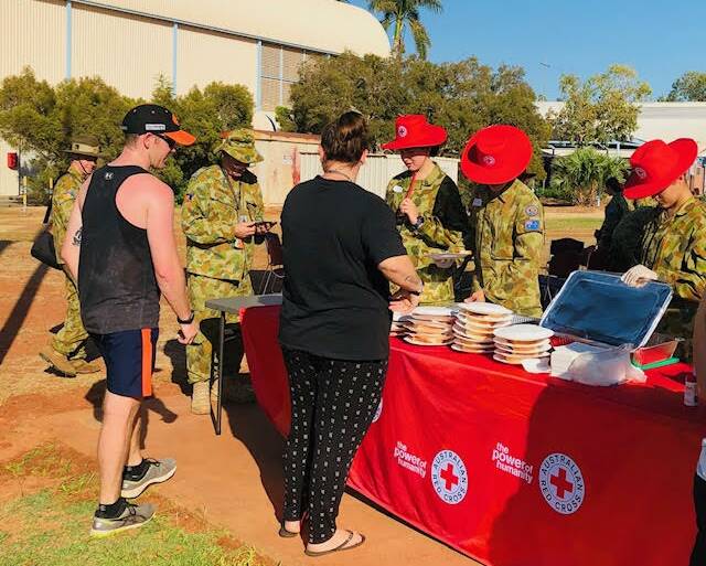The cadets organised a fundraiser for Red Cross and enjoyed serving Tindal's staff and
families breakfast. Picture: Nicki Asling. 