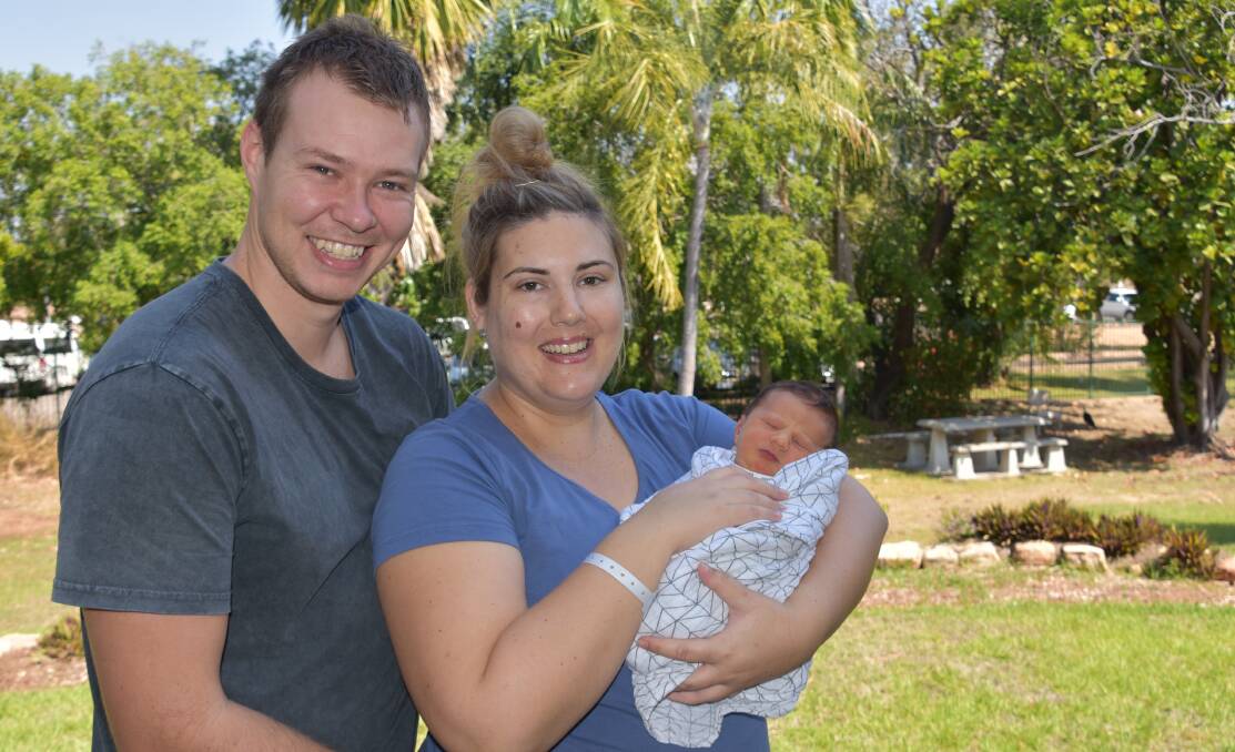 PARENT'S FIRST CHILD: Grady and Tara Humphries holding their new baby Ned Noel Humphries. 