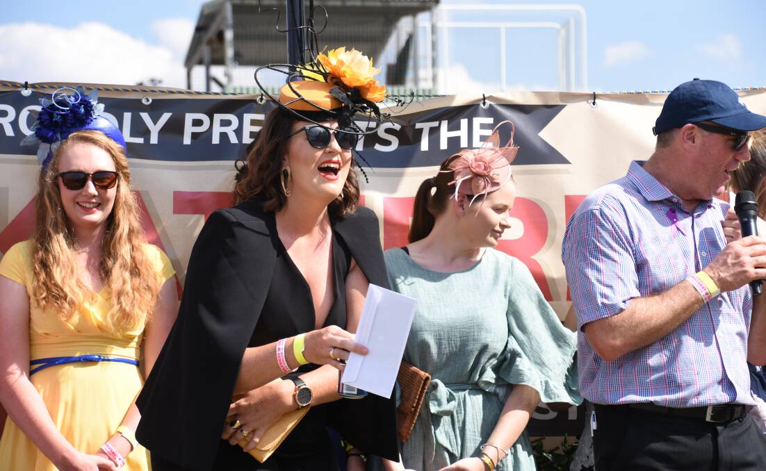 ON TREND: Fashion on the Field winner Sharon Jennings excitedly receives her prize.