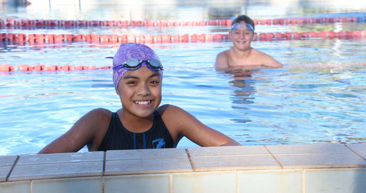 Ellamae Tisbe, 12, and Ryker Bitz, 11, spend most afternoons following school training for swimming competitions in the hopes of one day representing Australia. 