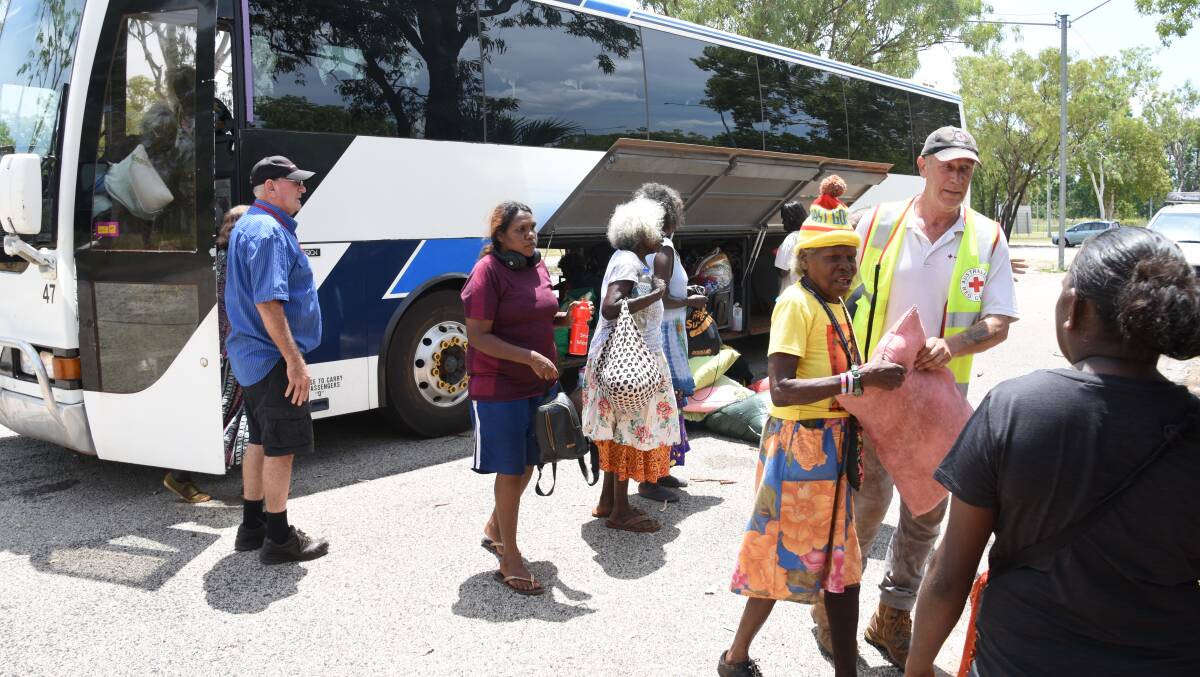 Numbulwar residents began arriving on buses yesterday with hastily packed bags and no clue as to how long they would be away from their homes. 