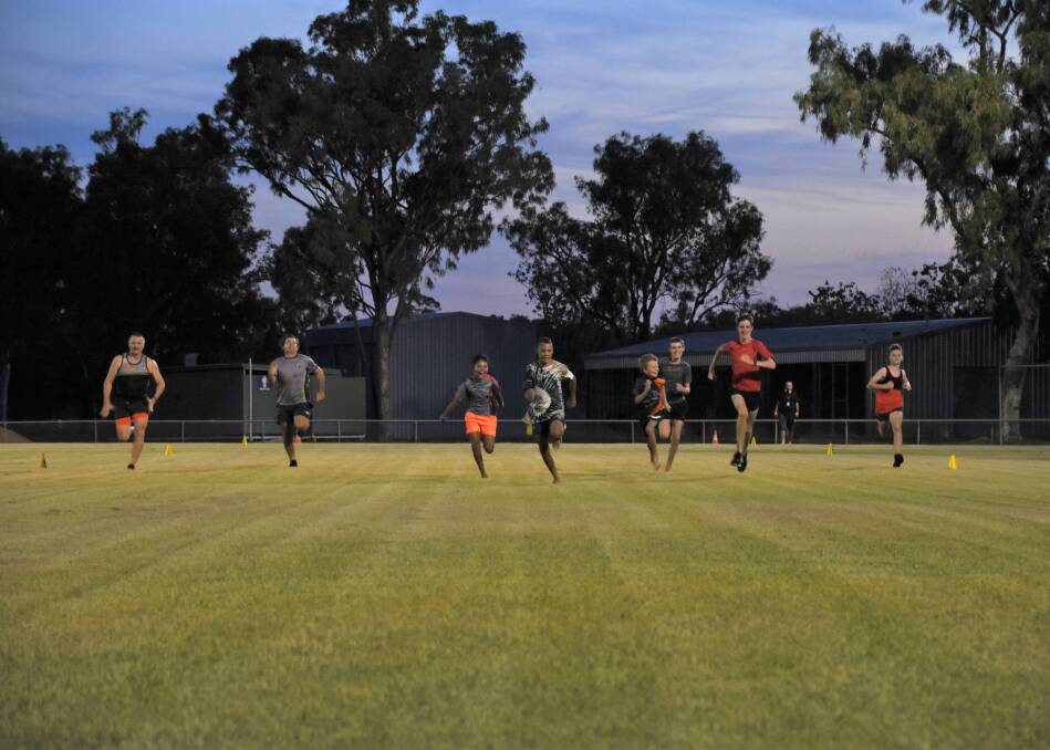 Sprinters compete in the All Comers race at the first Katherine Gift on Friday night at the Katherine Showgrounds. 