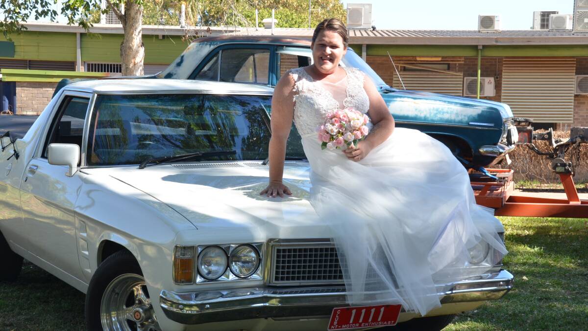 TIE THE KNOT: Kaccie Davidson stopped by a Katherine car show before her wedding to take some unique snaps. Picture: Supplied.