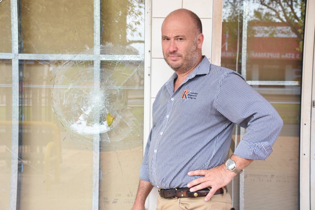 Business owner Philip Jazyschyn says he will camp at the front of his CBD store for the next couple of nights to guard it from more break-ins.