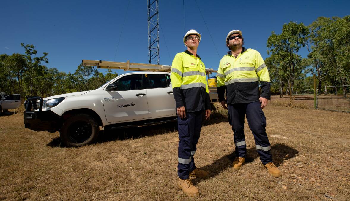 Power and Water's line crew Tony Wilson and Campbell Murphey have seen an increase in corellas wreaking havoc to power lines. Picture: Power and Water. 