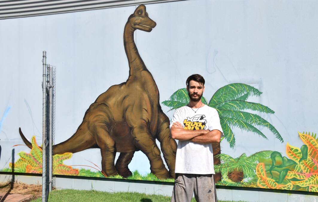Darwin graffiti artist Taylor Smith has produced a mural to brighten the playground area. Finishing touches are still to be added. 