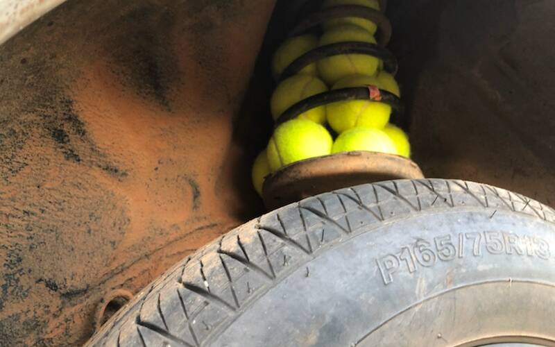 HANDY TIP: Ben McCormack and Sam Hyson's shocks blew up in their trusty Toyota. Tennis balls are a sure fix. 