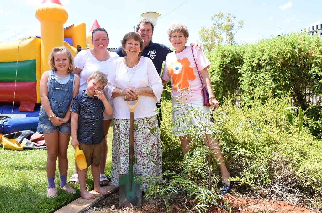 Former students Riley Prime and Sara Ducey, current student Lachie Prime, teacher's assistant Robyn Morris, Danny Murphy and Patty Buntine planted a Tamarind tree which will create plenty of shade as it grows. 