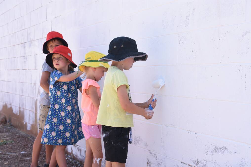 Edie Gardner, Lenny Gardner, Zoe Hard and Alex Hard take part in the first youth led mural, taking shape this week. 