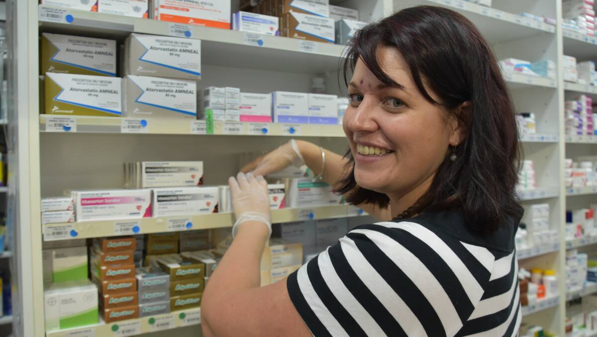 PROTECTING AGAINST VIRUS: The high rate of people contracting the flu can be reduced through vaccinations adminstered by Katherine pharmacist Jaimee Anderson. 