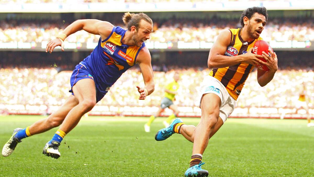 PLAY MAKER: Star Hawthorn forward and NT football genius Cyril Rioli (right) is heading to Katherine. Picture:  Scott Barbour/Fairfax Media.