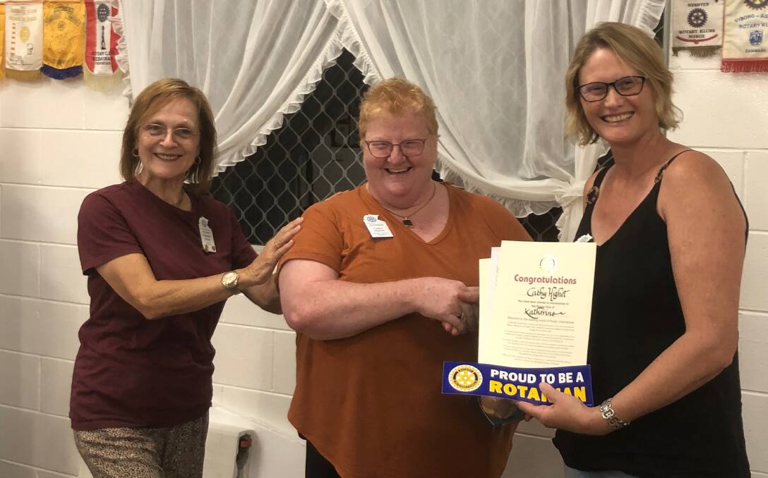 Cathy Highet (centre) is welcomed as a new member of Katherine Rotary.