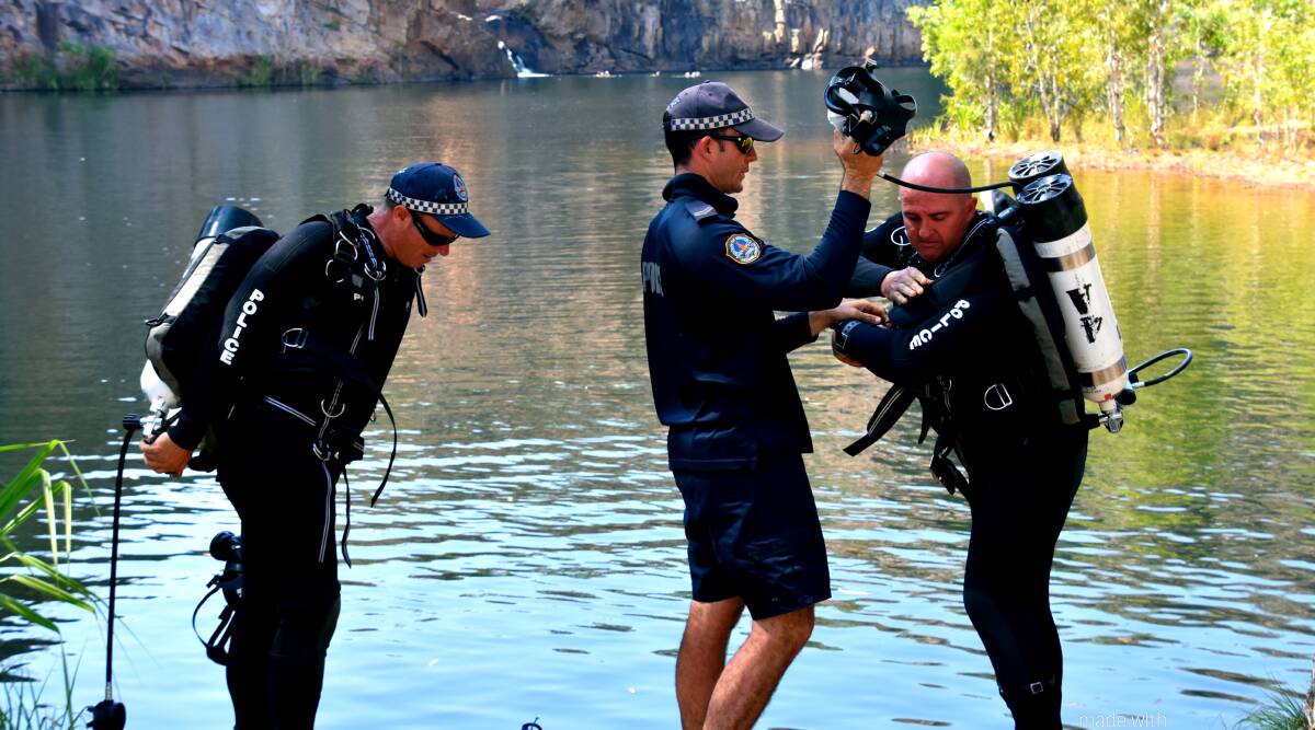 After a thorough search of the plunge pool perimeter, police divers were sent in for a grim search of  deeper waters.  