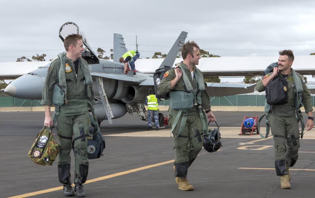 No. 75 Squadron pilots Flight Lieutenants Sam, Trent and James after their formation flight over South Australia at RAAF Base Edinburgh. Pictures: Defence Media.