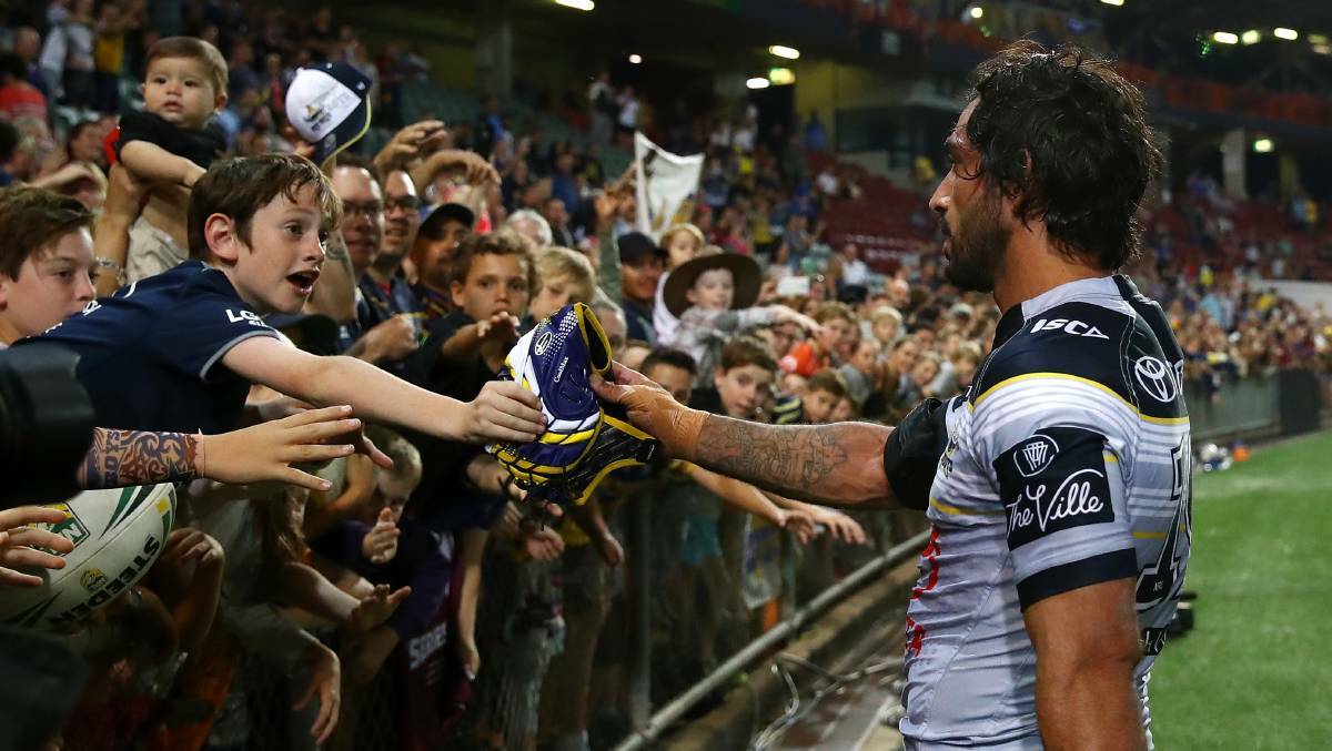 PROUD MOMENT: Rugby league legend Johnathan Thurston picks out the Katherine boy from the crowd. Picture: Getty Images.