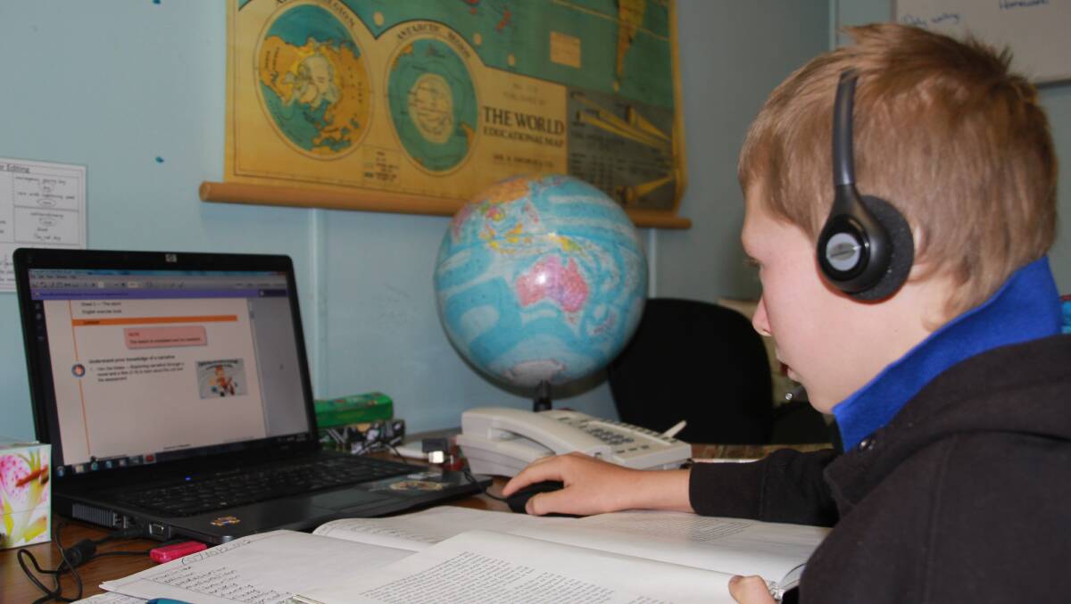 A school of the air student doing his daily lessons.  Photo: Sarah Cook.