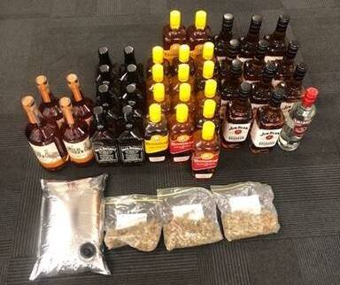 Alcohol and drugs were seized from a returning team plane, police have alleged. Picture: NT Police.