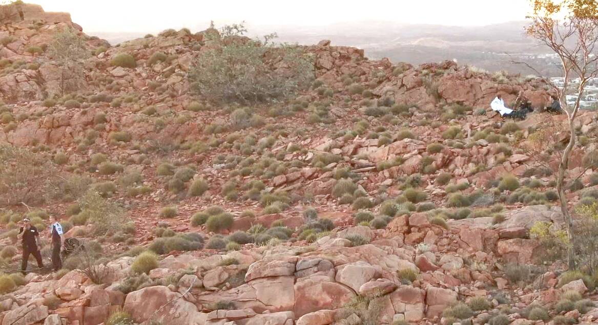 A drone and a helicopter worked in tandem to successful rescue a hiker atop the Eastern MacDonnell Ranges overnight. Picture: NT Police.