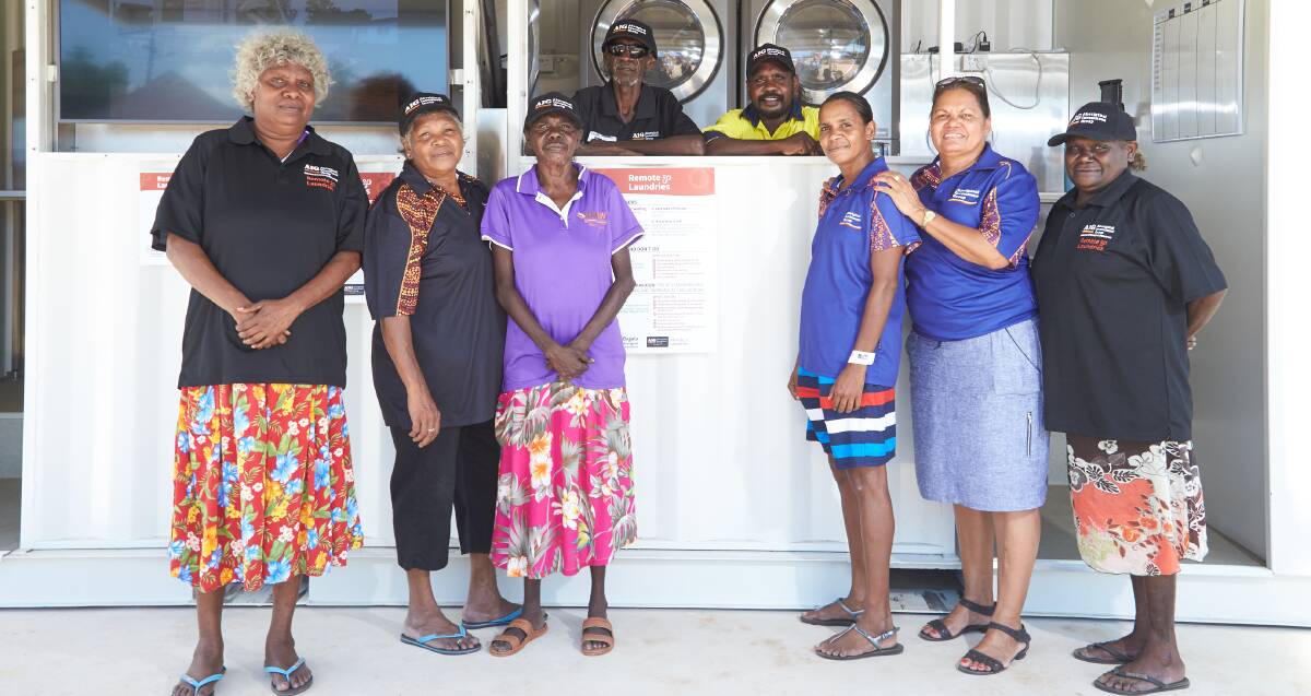 Laundry staff, AIG Board members and Bagala Aboriginal Corporation board members at the laundry in Barunga. Pictures: supplied.