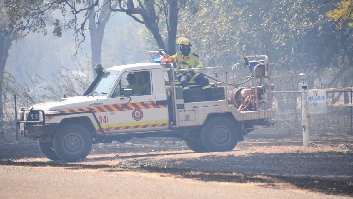 Patrolling the perimeter of the dangerous fire near Stuart Estate yesterday afternoon. Picture: Roxanne Fitzgerald.
