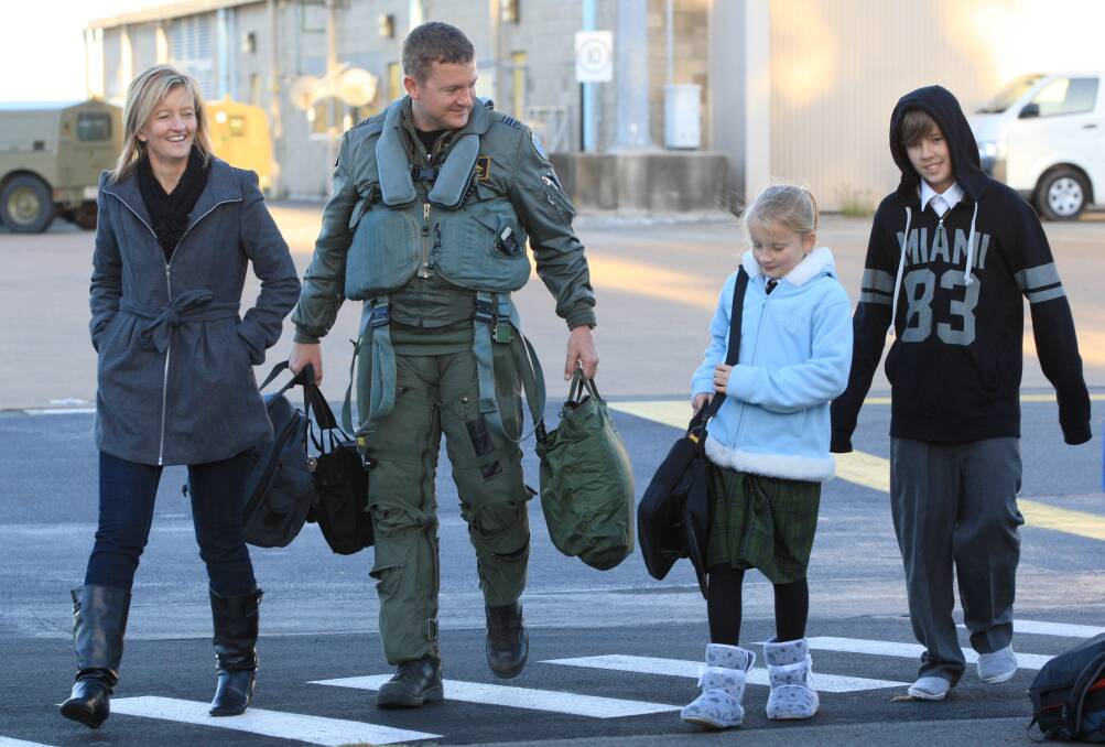 Welcomed home by his family after attending a fighter combat commanders course in 2011.