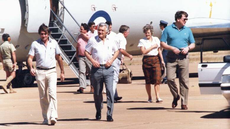 Prime Minister Bob Hawke (with then wife Hazel to the right and behind) arrive at Tindal in 1988.