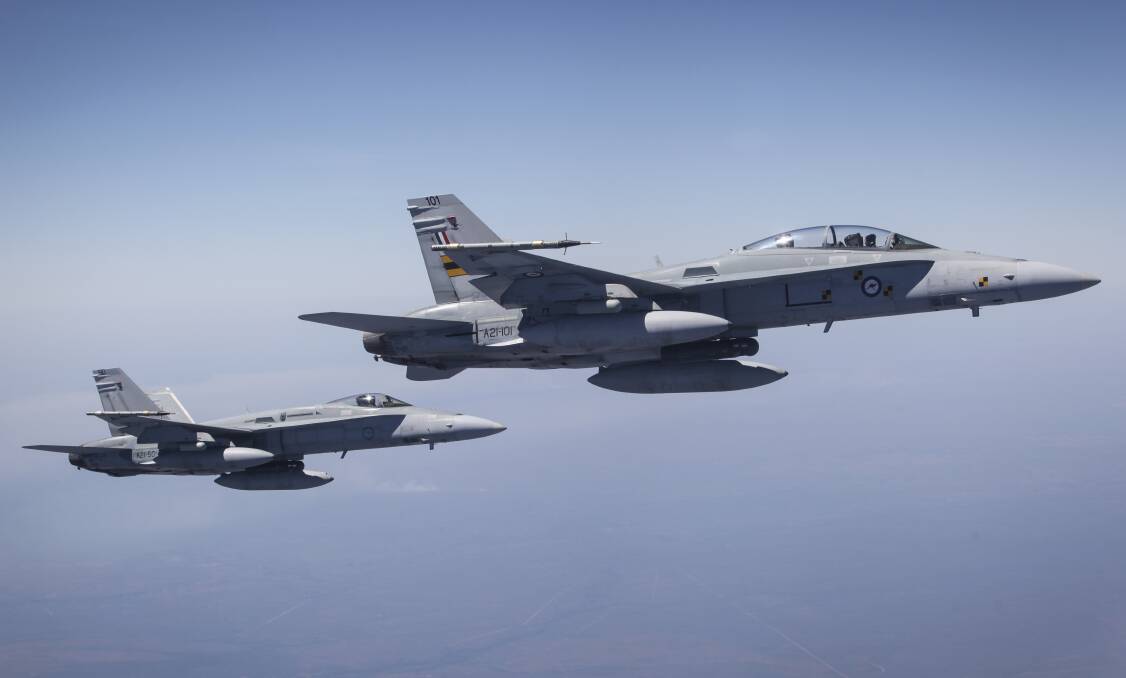 F/A-18A/B Classic Hornets from Tindal RAAF Base will be taking part in the 78th anniversary of the bombing of Darwin tomorrow. Pictures: Department of Defence.