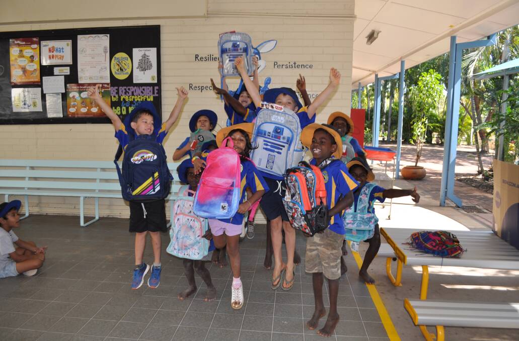 Charity hands out backpacks to help carry school books