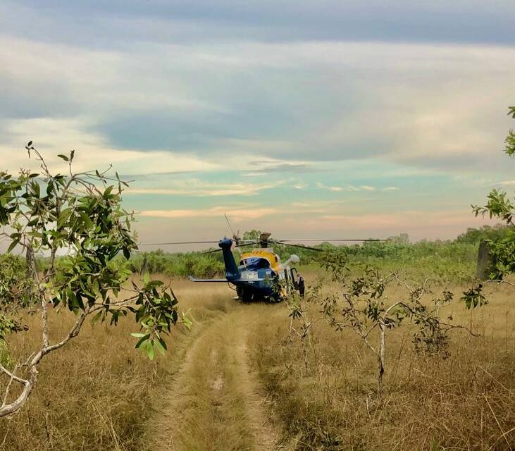 The CareFlight helicopter lands on a bush track near Dundee.