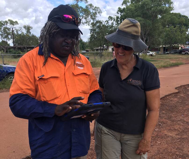 Roper Gulf staff member John Adidi learns about the animal health database with AMRRIC’s Jan Allen. Picture: supplied.