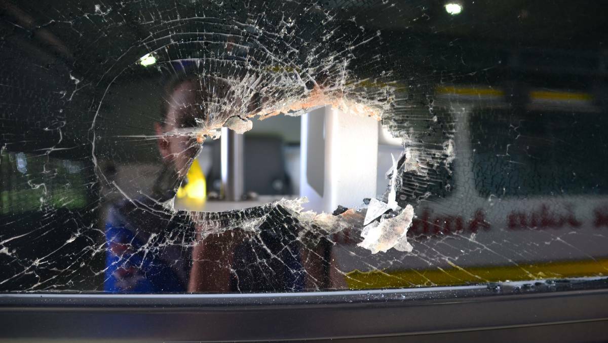 The smashed window from another incident in Katherine last year.