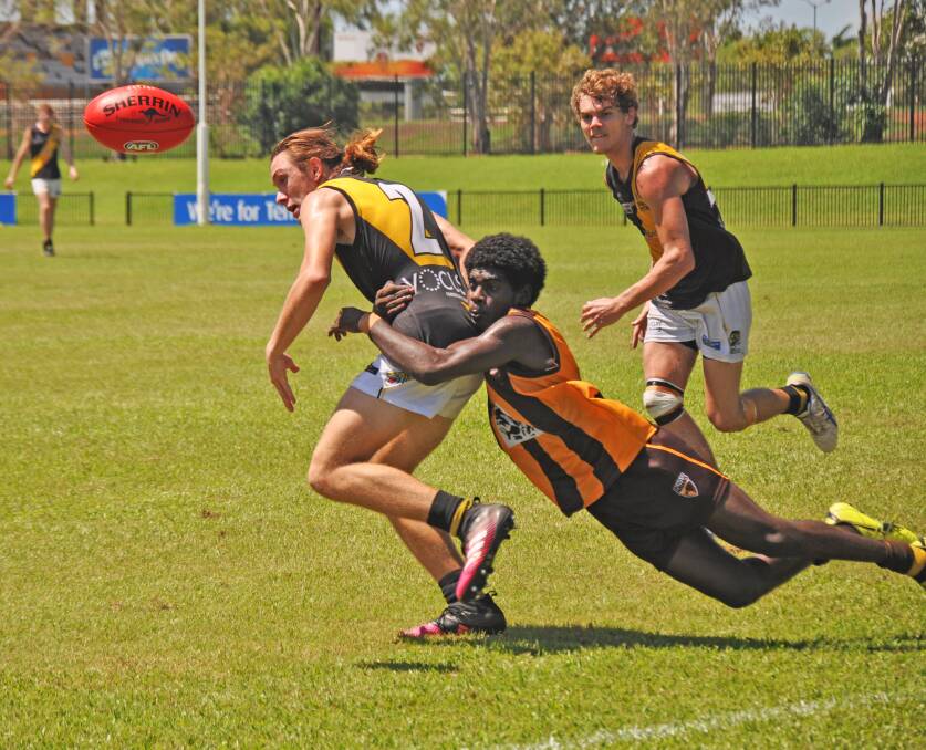 GOTCHA: Tackling was a feature of the Big River Hawks Under 18's boys game in Darwin on Saturday.