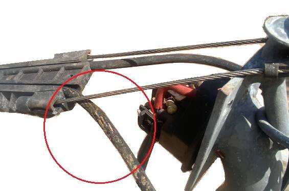 Damaged insulation on an overhead power line making contact with stainless steel braided wire. Pictures: NT WorkSafe.