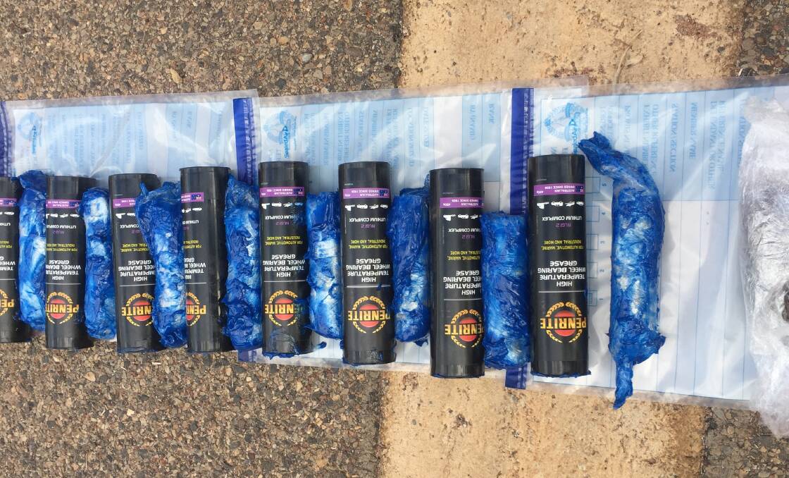 Police allege the drugs were hidden in these grease canisters.
