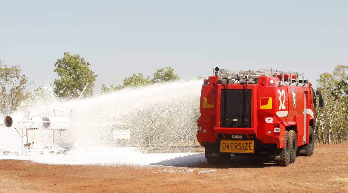 Firefighting foam being used in training at the Tindal RAAF Base, now the problem is cleaning up the mess.