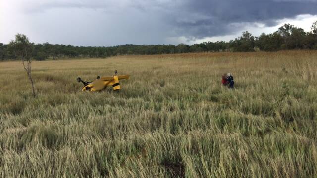 TIPPED OVER: The light aircraft overturned on boggy ground. Pictures: CareFlight.