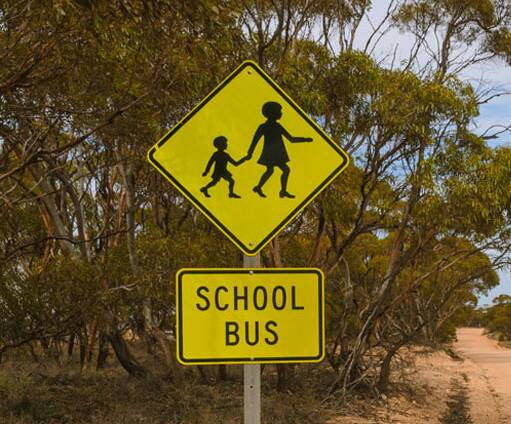 A group of students have been banned from Katherine school bus travel after rocks and a knife were thrown at a bus.